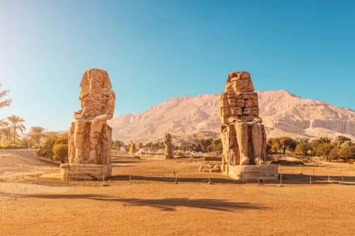 Colossi of Memnon statues on Luxor West Bank, a key stop on Karnak and Valley of the Kings day tour