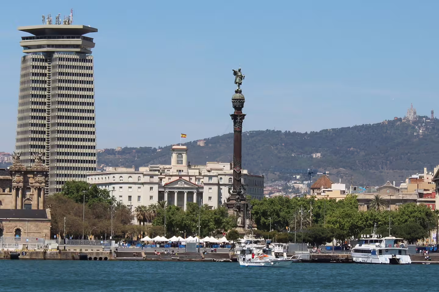 View of the Columbus Monument and waterfront in Barcelona, a highlight on the Gothic Quarter walking tour and boat trip.