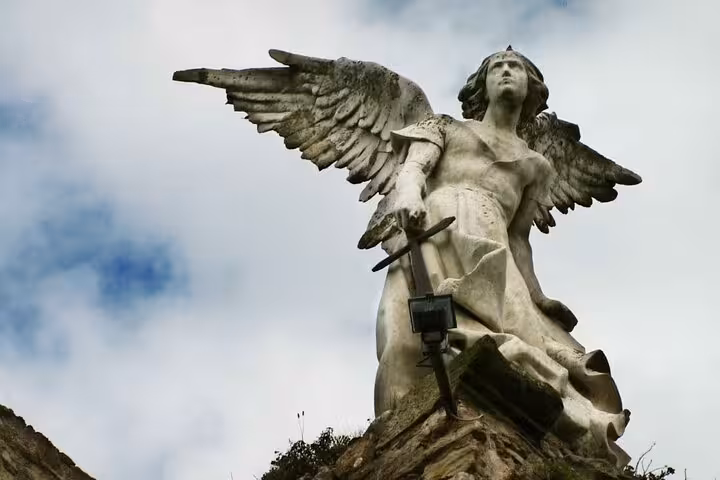 Majestic angel statue in Comillas, showcasing intricate artistry on the Santander Modernism and Gaudi tour.