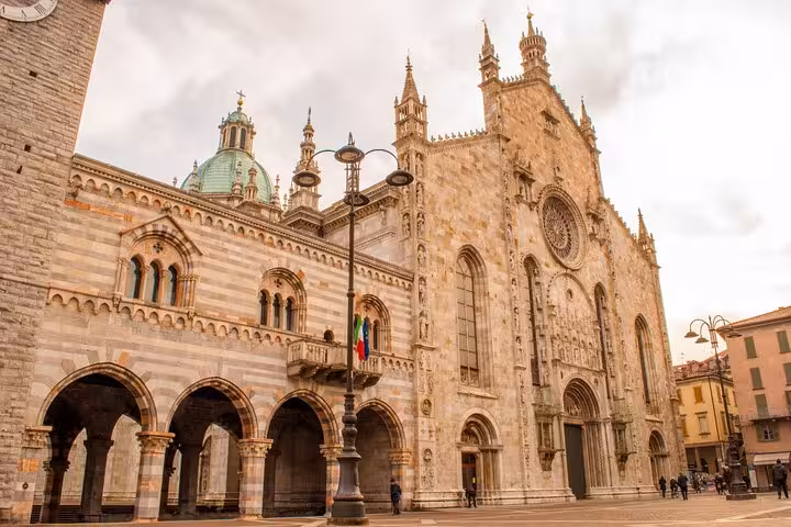 Como Cathedral facade in Piazza Duomo, highlight of Lake Como Bellagio and Varenna day tour from Milan