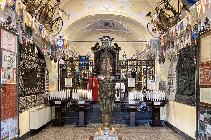 Como cathedral interior with votive candles and historic decor, stop on Como and Bellagio tour from Milan