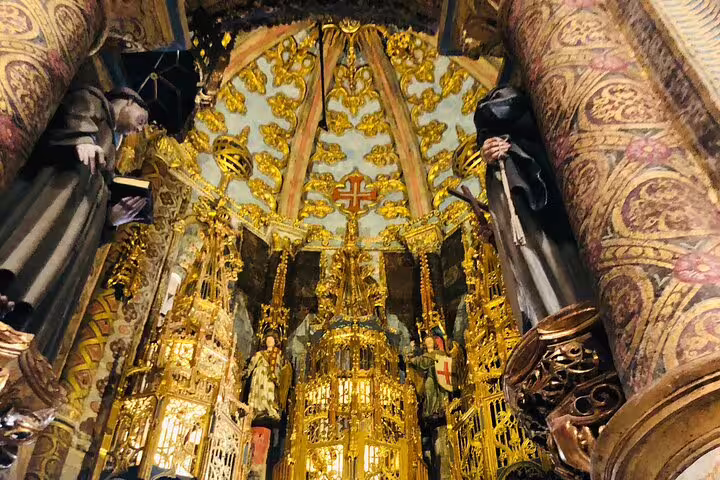 Intricate interior of the Convent of Christ in Tomar, showcasing stunning Gothic architecture and Templar history details.