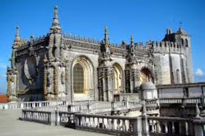 Explore the majestic Convent of Christ in Tomar on the Templars Route, showcasing its intricate Gothic architecture.