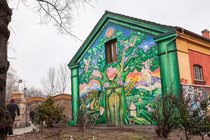 Colorful mural on a building in Freetown Christiania, captured during a private full-day tour of Copenhagen's unique attractions.