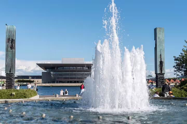 Fountain view of the Copenhagen Opera House during a sunny day on a private full-day tour highlighting Denmark’s architecture.