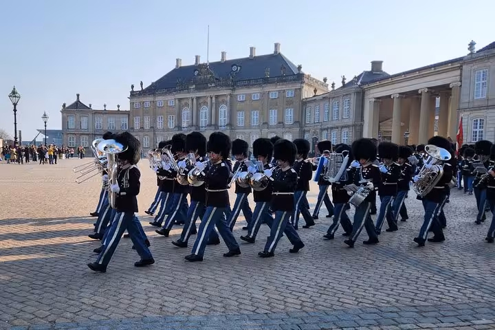 Royal guards marching at Amalienborg Palace during the Change of Guards ceremony in Copenhagen.