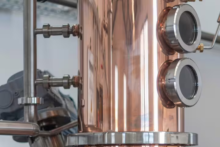 Copper rum distillation equipment showcased on the Sunny Southwest tour, highlighting the craft of rum production.