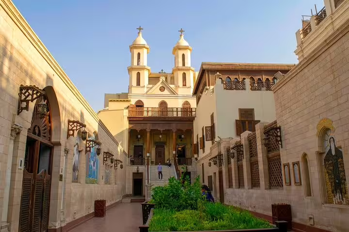 Coptic Cairo church courtyard with twin bell towers, stop on private tour to Cave Church and felucca ride