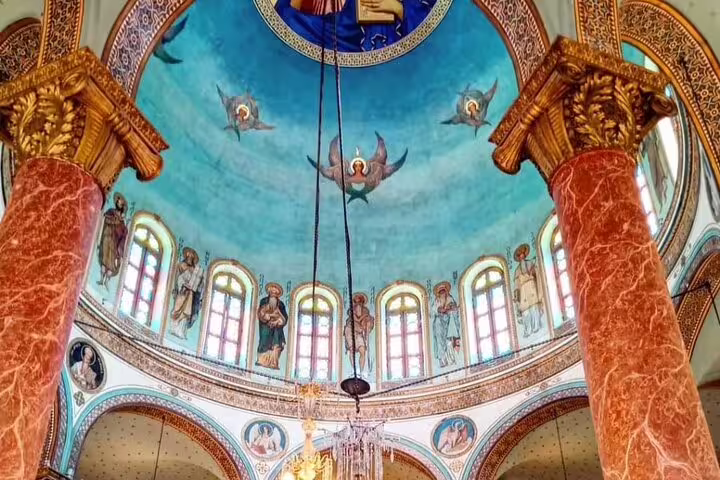 Painted dome and icons inside a Coptic Cairo church, featured on private Coptic Cairo and Cave Church tour