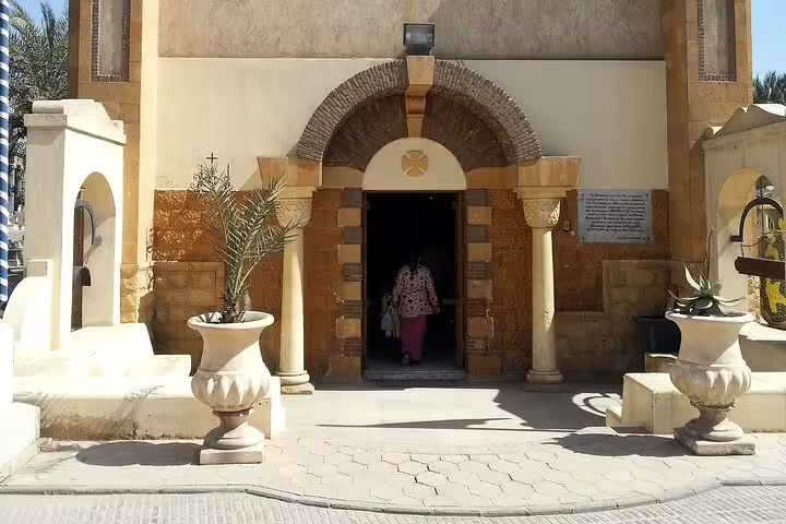 Entrance arch of a Coptic Cairo church with columns, visited on private tour to Cave Church and Nile felucca ride