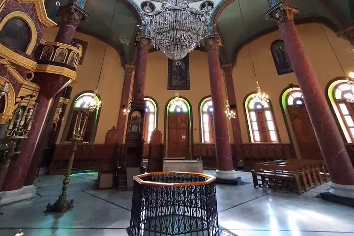 Church interior in Coptic Cairo with chandelier and columns, part of Cairo Citadel and Khan El-Khalili tour