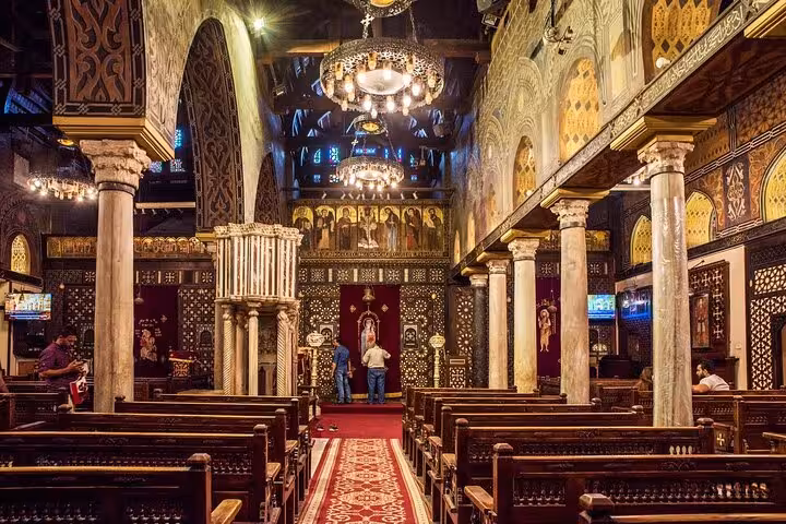 Interior of Coptic Cairo church with chandeliers and icons, featured on private guided Old Cairo and Citadel tour