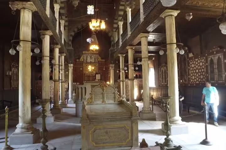 Ancient Coptic church interior with marble columns and ornate altar, part of private Coptic Cairo tour in Egypt