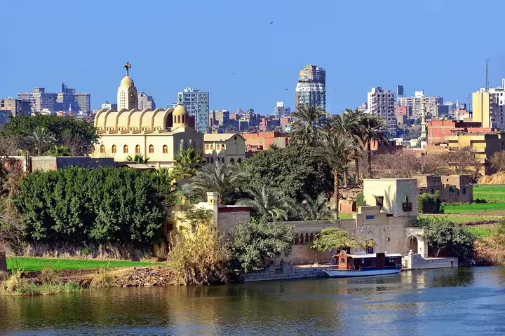 Nile River view near Coptic Cairo with church skyline, scenic felucca ride stop on private Cairo day tour