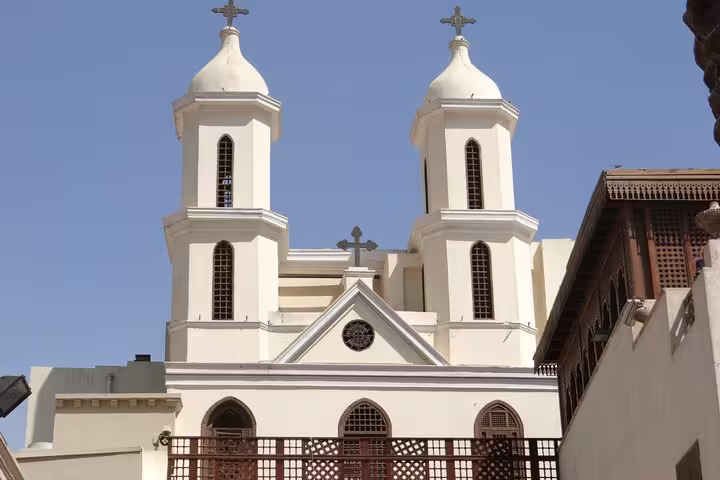 Historic Coptic Cairo church with twin towers, key stop on Cairo highlights tour with museum visit