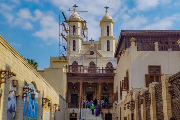 Old Cairo Coptic church exterior with twin towers and courtyard, included in private 2-day Cairo tour package