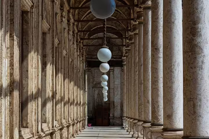 Stone colonnade in Coptic Cairo church complex, a serene stop on the private tour to Old Cairo and Islamic Cairo