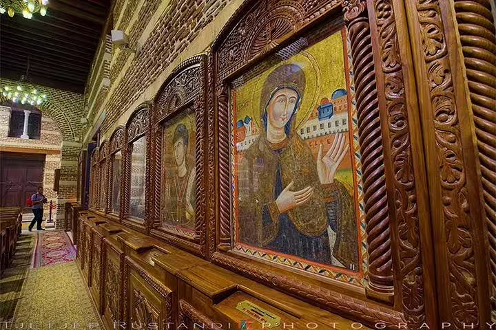 Carved wooden iconostasis with Christian icons in Coptic Cairo church on Cairo Museum, Citadel and Nile cruise
