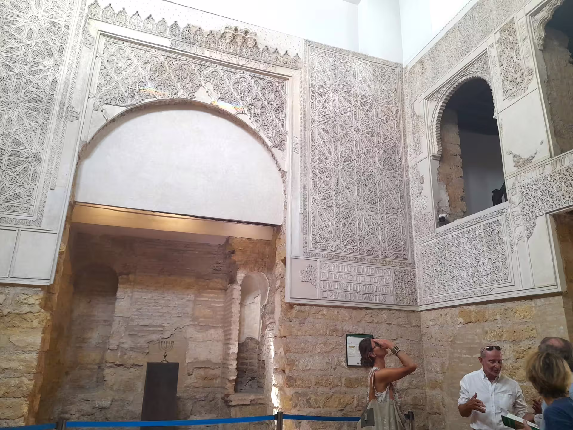 Ornate Moorish arches and carved stucco inside the Alcazar on a Cordoba private walking tour with guide
