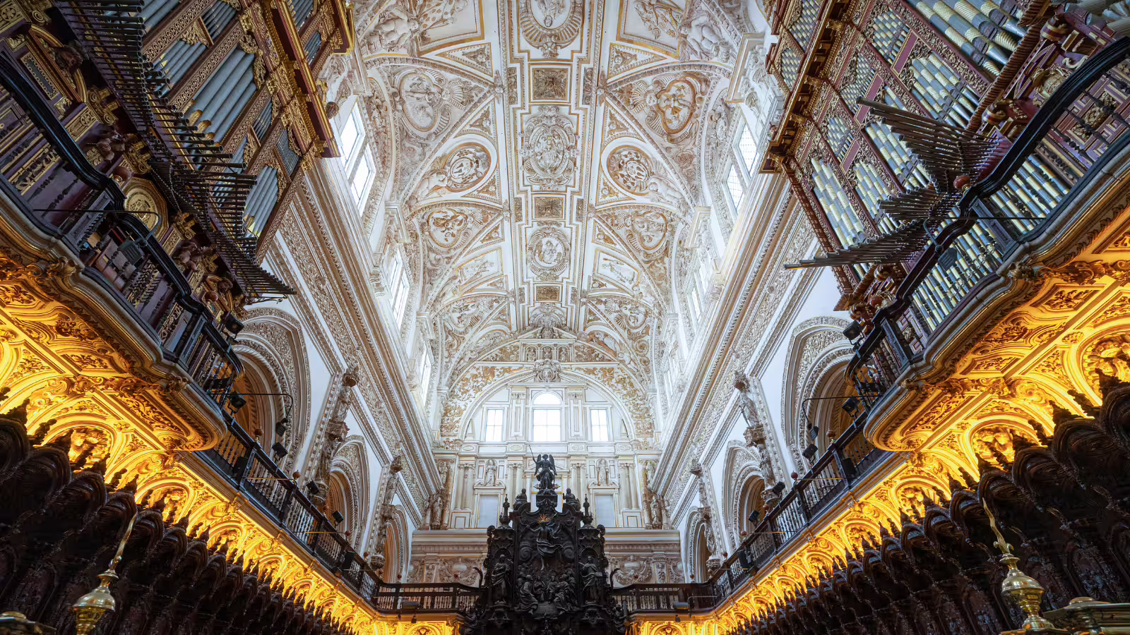 Ornate Baroque ceiling and grand pipe organ inside Cordoba Cathedral on private day trip from Costa del Sol