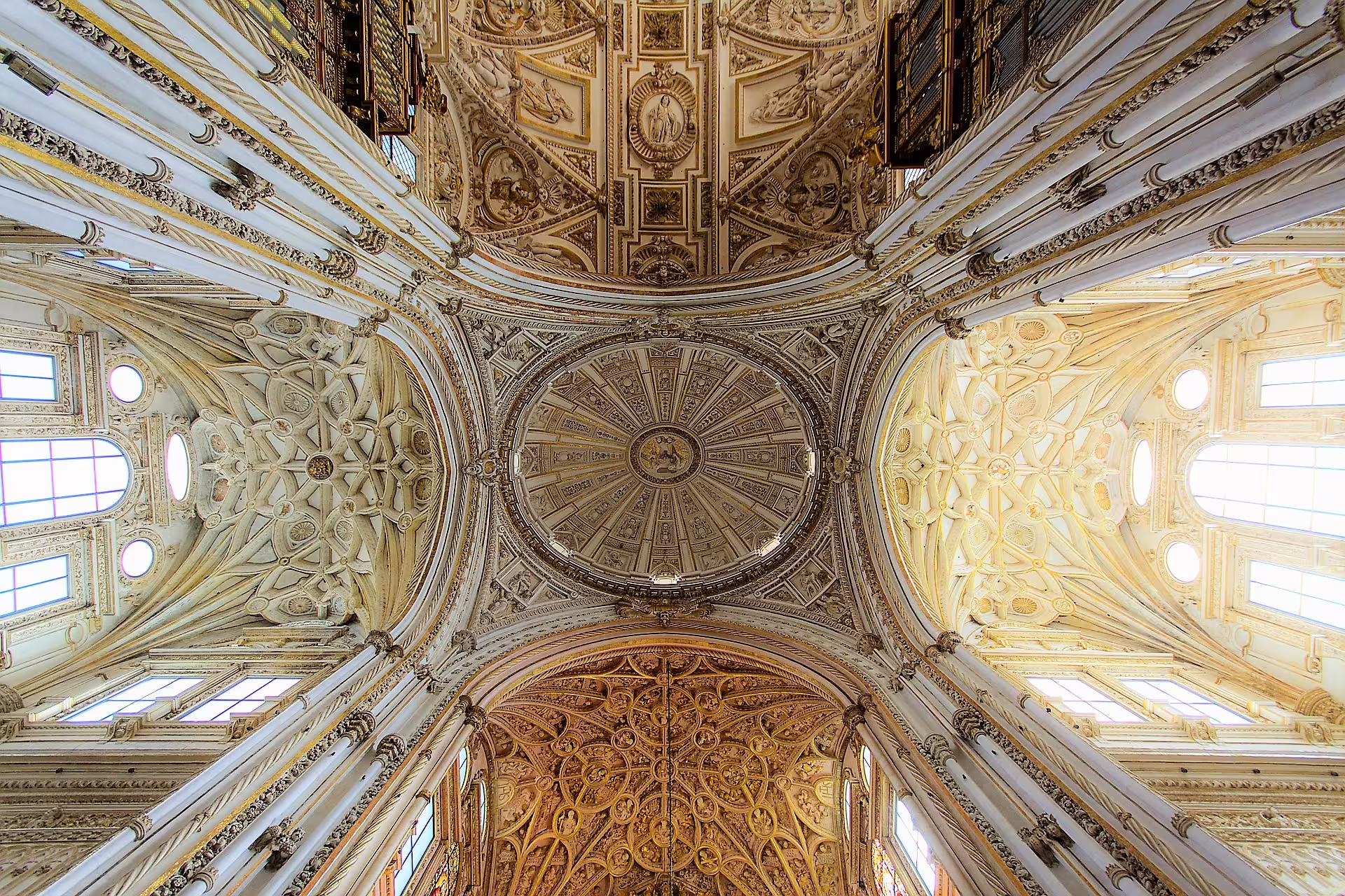 Ornate cathedral dome ceiling in Cordoba, Spain, viewed on a guided group walking tour of historic landmarks