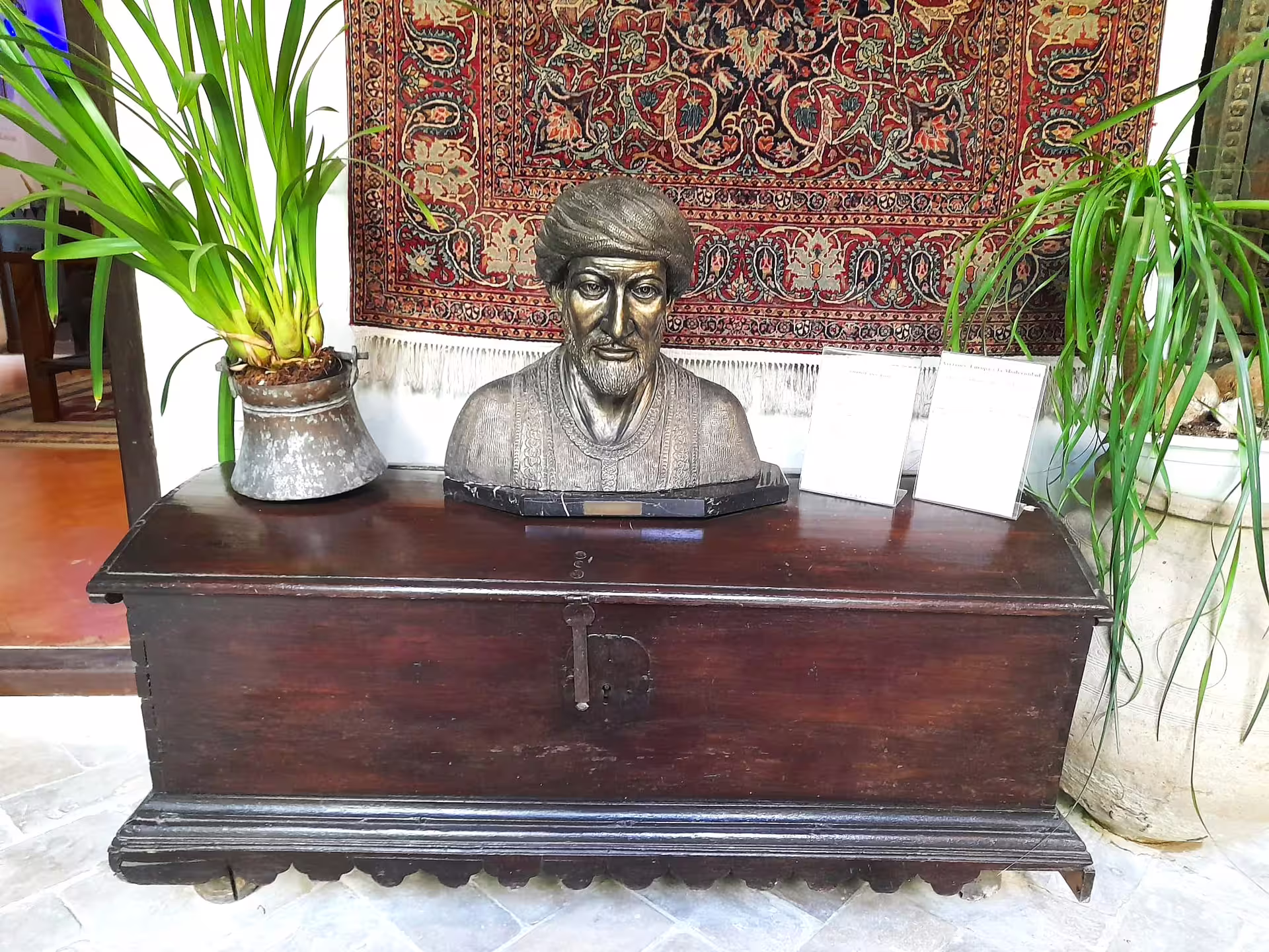 Bust and decor in a traditional Cordoba patio museum stop on a private Costa del Sol to Cordoba day trip