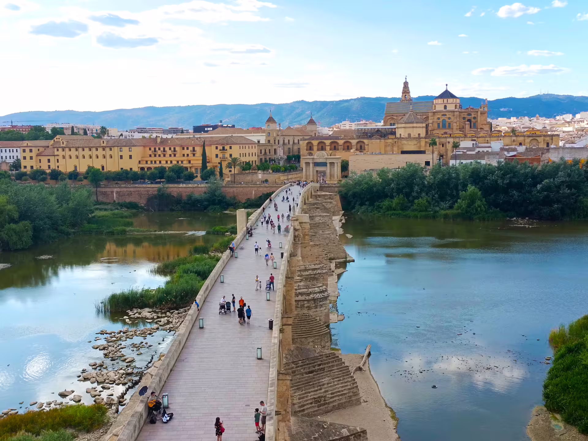 Roman Bridge over the Guadalquivir with Córdoba skyline and Mezquita, seen on a private walking tour