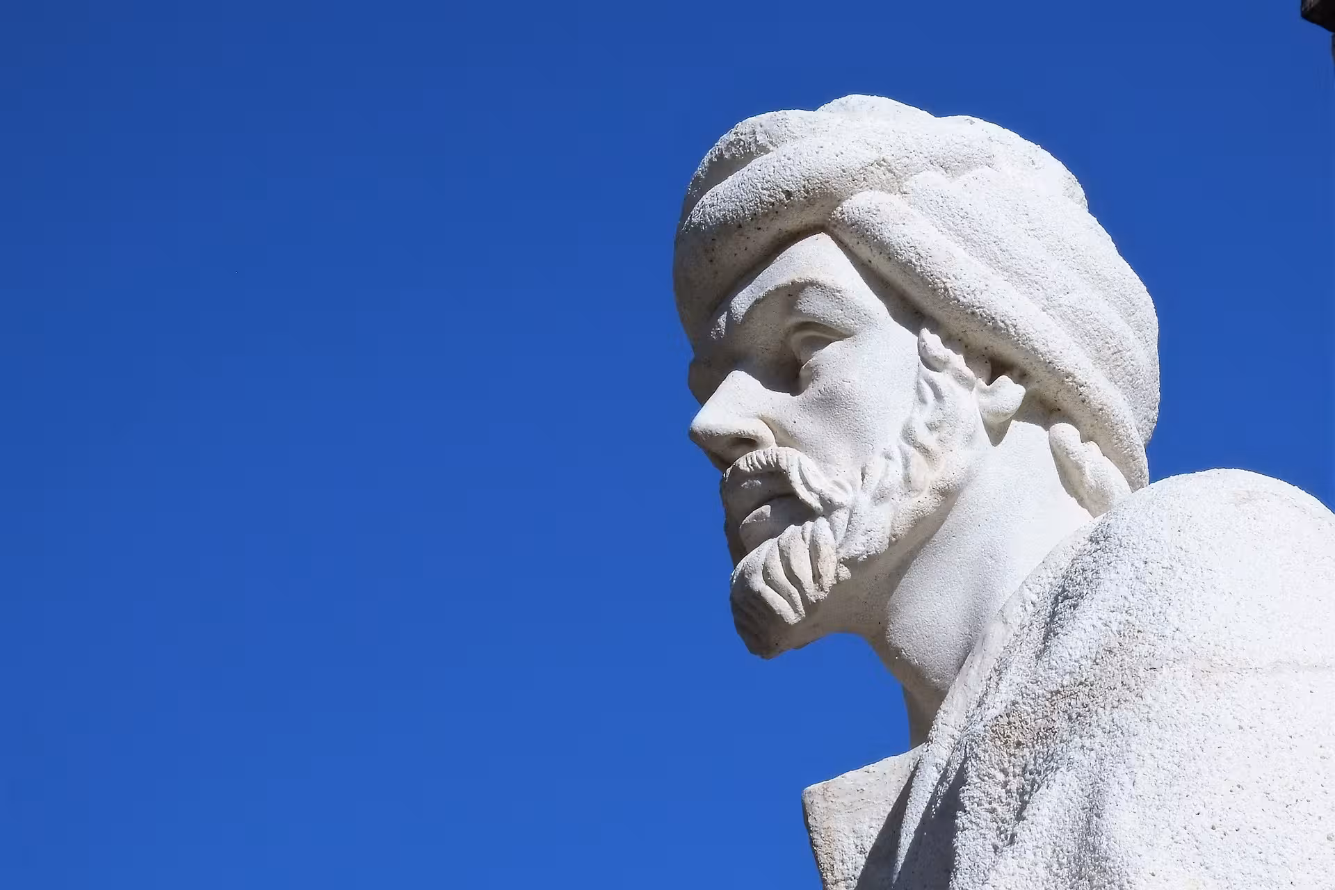 Statue against a clear blue sky in Córdoba, highlighting the city's rich history and architectural heritage.