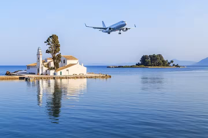 Airplane approaches Corfu over Mouse Island, ideal backdrop for Corfu airport and port private transfer