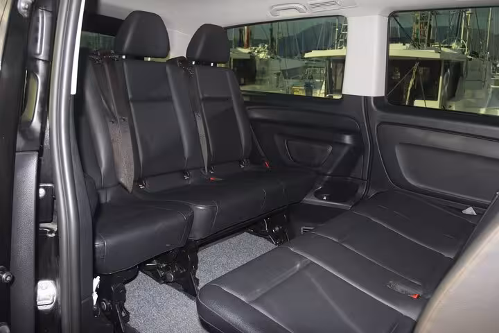 Spacious black leather minivan interior for Corfu private transfer from airport or port, comfortable seating