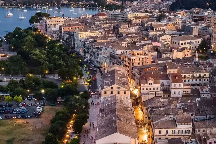 Aerial view of Corfu Old Town and Spianada at dusk, scenic stop on a Corfu in a day private tour