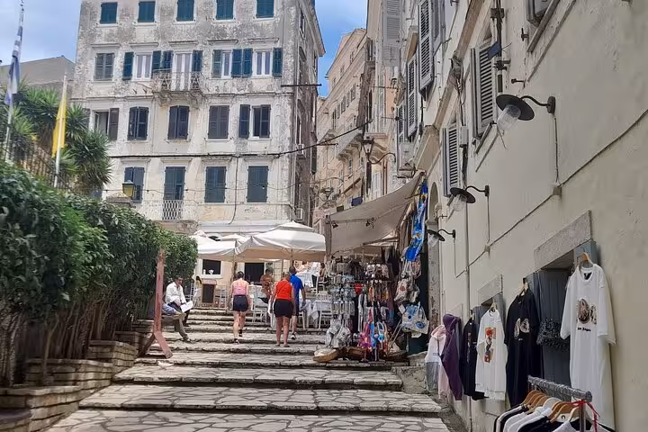 Stone steps in Corfu Old Town leading to cafes and market stalls, scenic highlight of the Top 5 Corfu tour