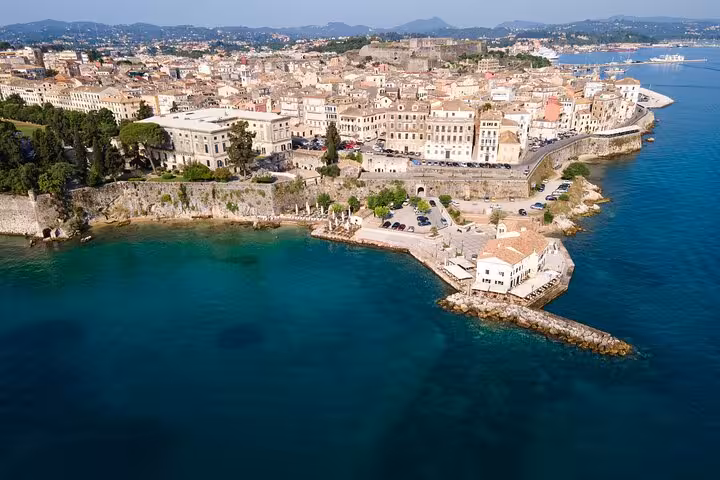 Aerial view of Old Corfu Town waterfront and Venetian fortress walls, highlight of a private walking tour