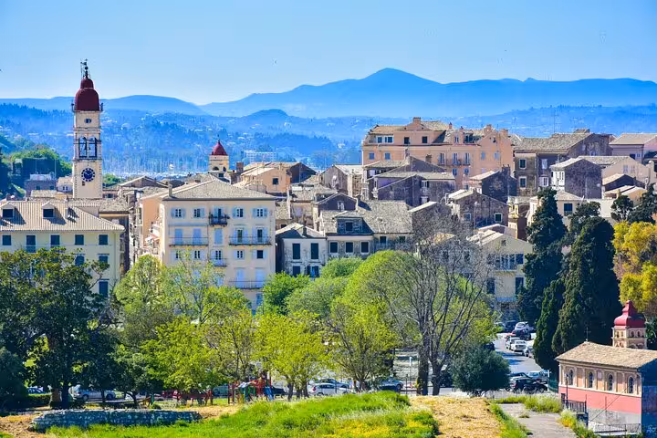 Panoramic Corfu Town skyline with historic bell tower and old rooftops, a highlight of the 4-hour small group tour