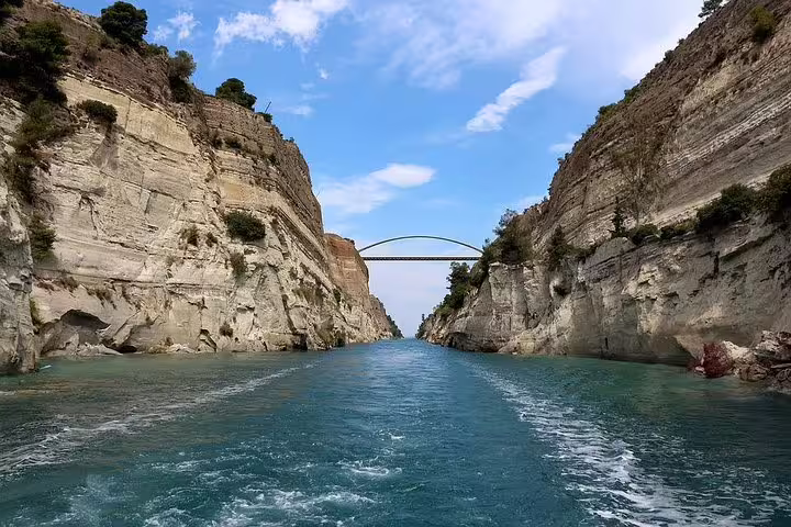 Corinth Canal cliffs and bridge view from the water, iconic photo stop on private day trip Athens to Nafplio