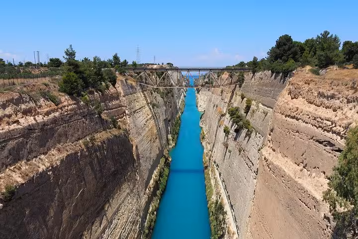 View of Corinth Canal’s steep cliffs and turquoise water on a day trip from Athens to the Peloponnese