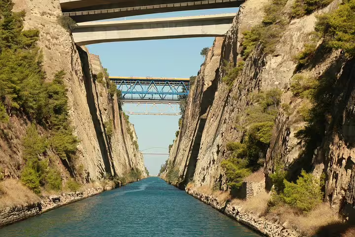 Cruising through the Corinth Canal beneath bridges on an Ancient Corinth and Corinth Canal half-day private tour