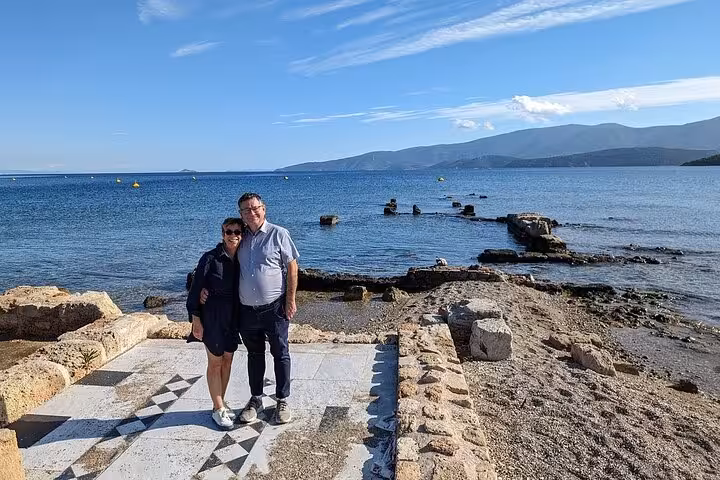 Visitors at ancient Corinth harbor ruins by the sea on St Paul’s Footsteps 6-hour Biblical tour to Corinthians