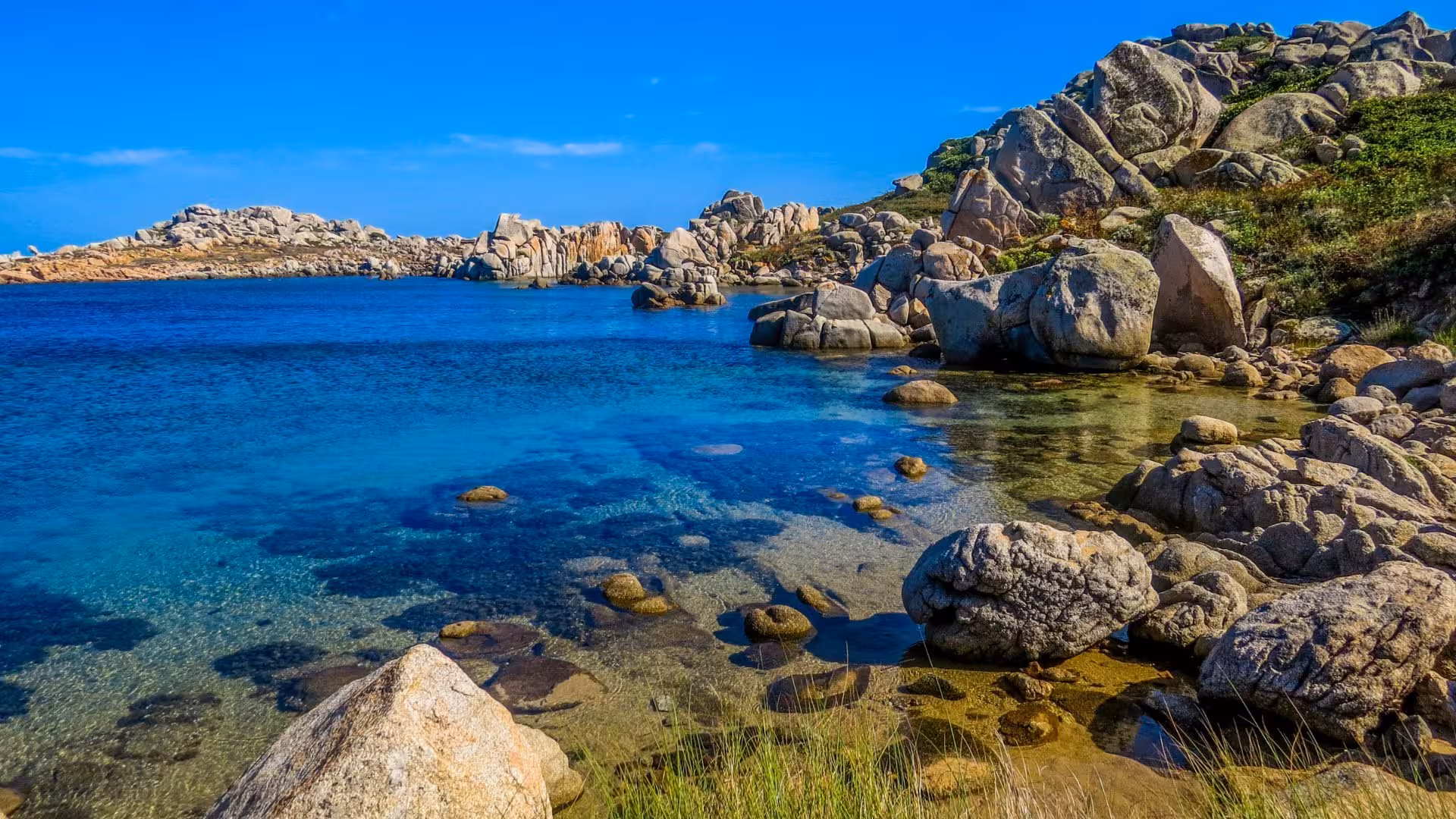 Rocky coastline and azure waters in southern Corsica, perfect for exploring on a 4-hour RIB tour from La Maddalena.