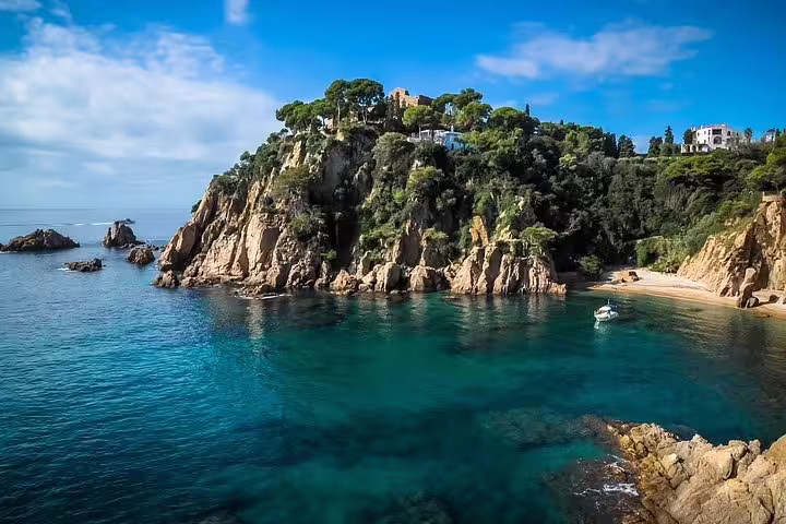 Stunning view of rocky coastline and clear blue waters on Costa Brava tour near Dalí Museum.