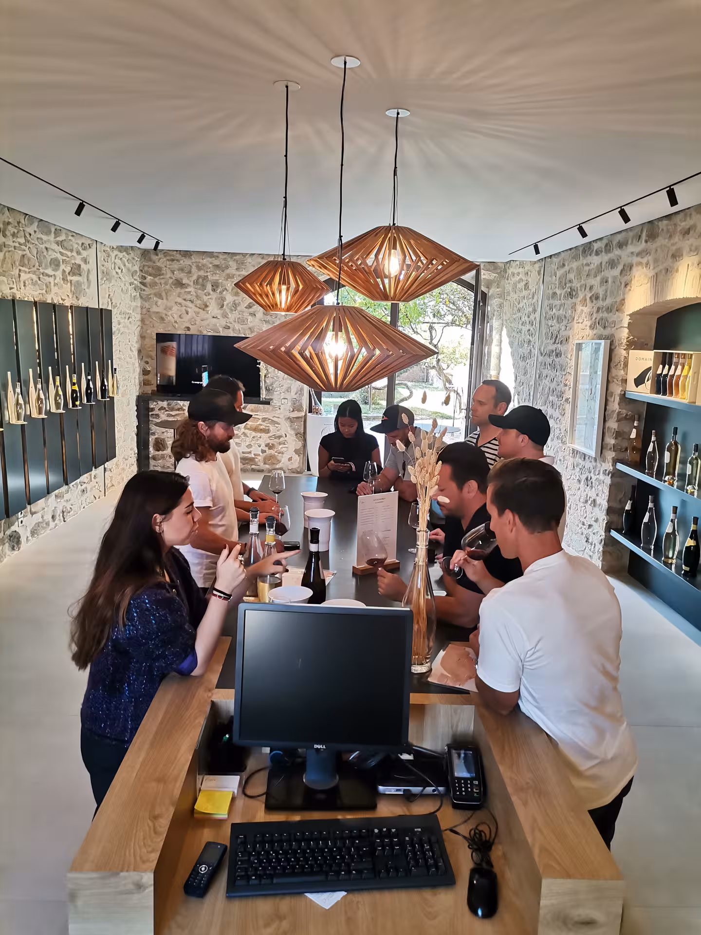 Wine tasting in a Coteaux d’Aix-en-Provence cellar, guests sampling rosé near Sainte-Victoire