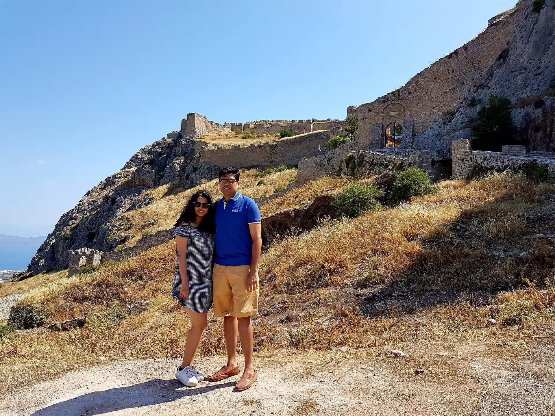 Couple at Acrocorinth fortress ruins in Ancient Corinth on a private day tour from Athens to Corinth and Mycenae