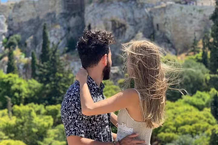 Couple admiring the scenic view of the Acropolis in Athens during a private 6-day Greece tour.