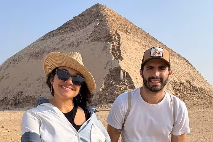 Couple posing by the Bent Pyramid at Dahshur on a private Saqqara Memphis and Red Pyramid day tour