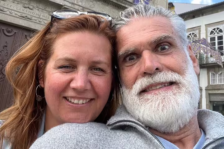 Happy couple selfie during Braga scavenger hunt, exploring historic streets on a self-guided walking tour