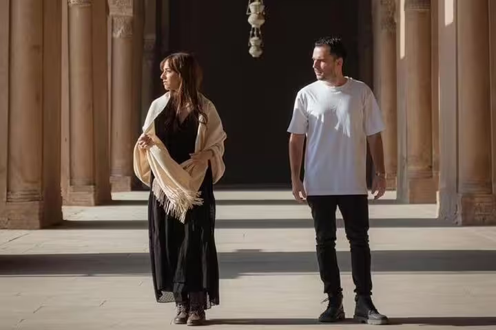 Couple exploring historic Cairo mosque courtyard on a 2-day private guided tour with local Egypt guide