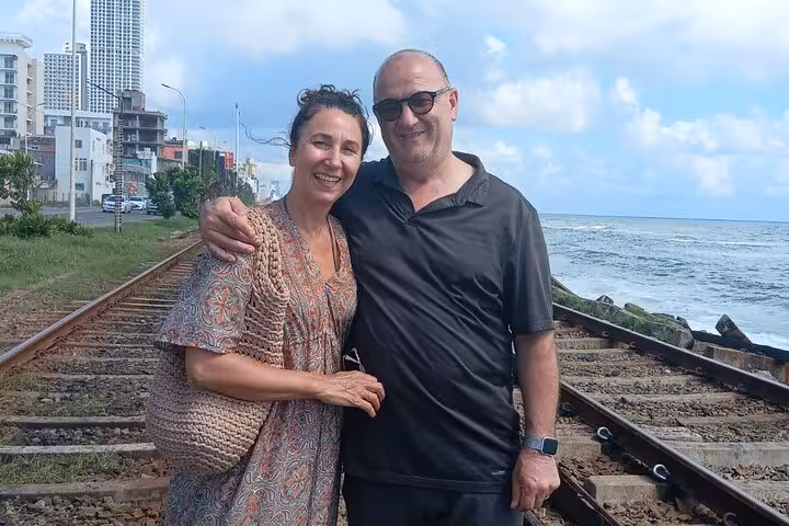 Couple photo by Colombo coastal railway and ocean on Royal City Tuk Tuk low price all-inclusive city tour