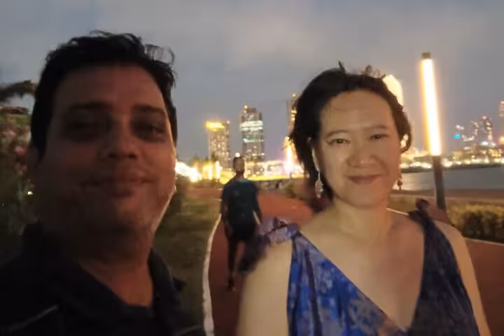 Couple at Colombo waterfront at night with skyline views during Royal City Tuk Tuk all inclusive tour