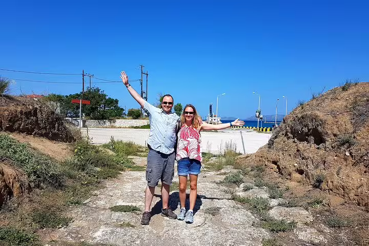 Happy couple at Corinth Canal viewpoint on private Athens day tour to Corinth, Epidaurus and Isthmus