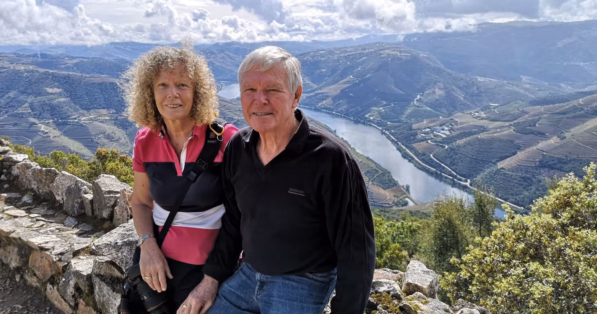Couple at Douro Valley viewpoint overlooking Douro River, Braga small-group wine tour with cruise and lunch